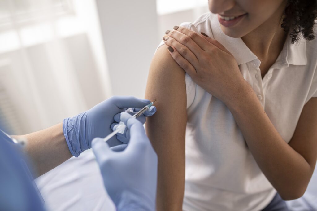 woman getting vaccinated to prevent gynecologic cancer