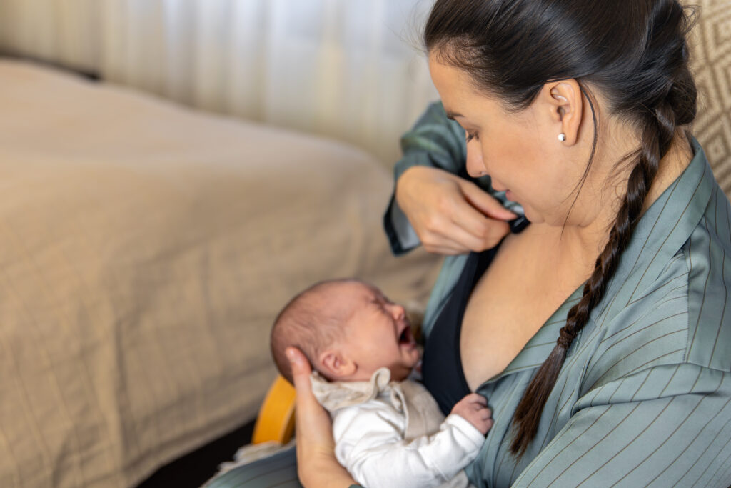 woman struggling with breastfeeding