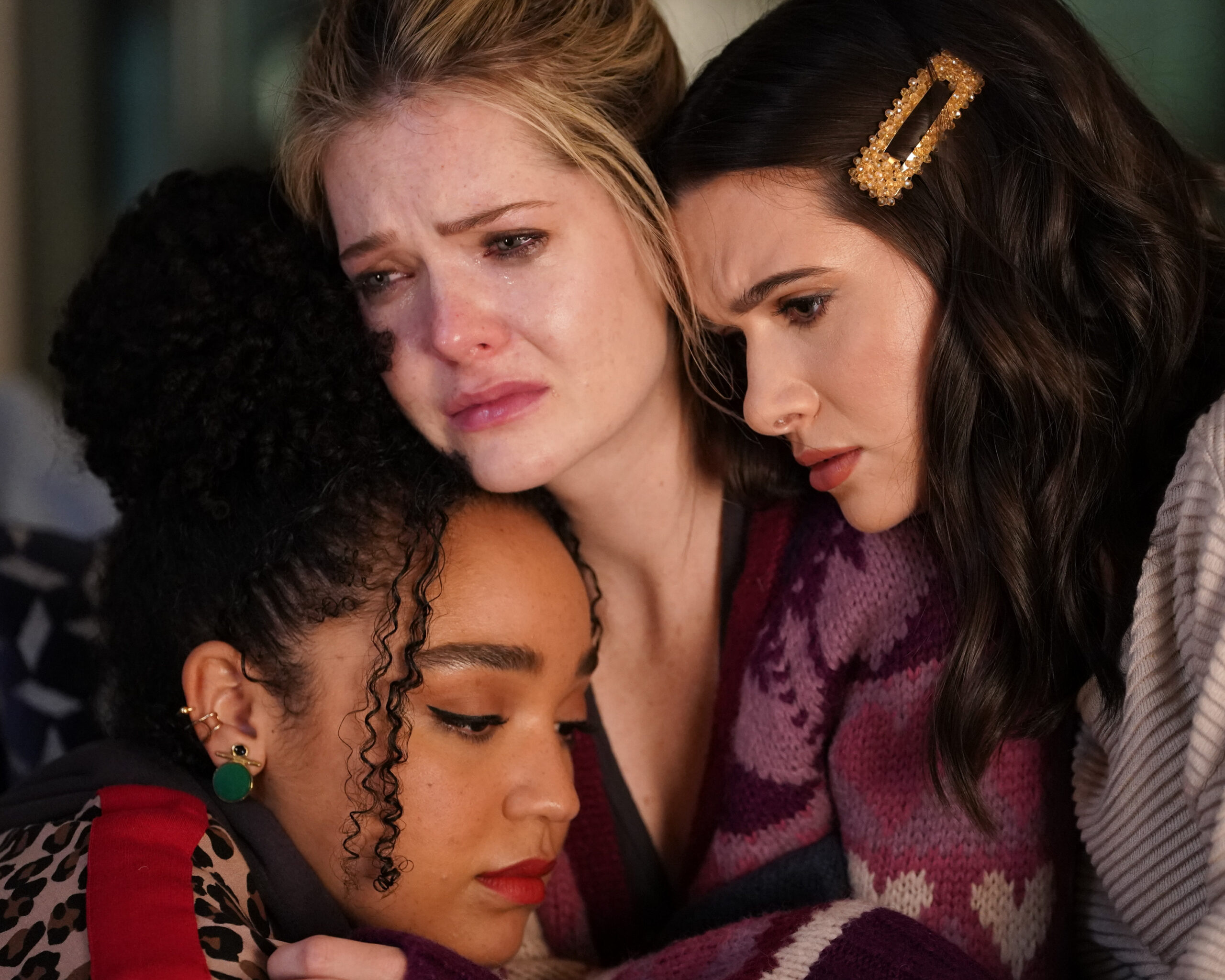 Three women comforting one another during an emotional scene in “Lost,” Season 4, Episode 13 of The Bold Type.